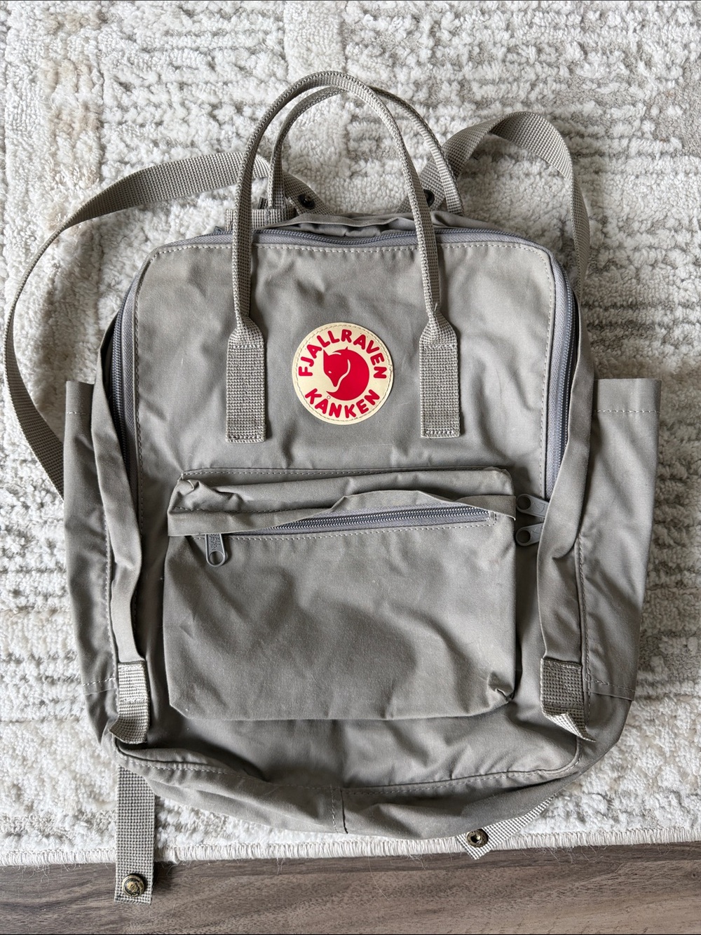 Fjallraven Kanken Backpack in Light Gray with Red Logo